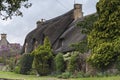 Thatched cottages with climbing plants in the village of Broadway, in the English county of Worcestershire, Cotswolds, UK Royalty Free Stock Photo