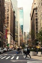 Broadway street in Manhattan`s midtown by early evening, New York City, United States. Toned image