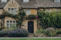 Facade and front garden of a traditional limestone house in Broadway, Cotswolds, UK
