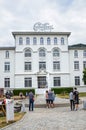 Broc, Switzerland - July 27, 2019: People waiting in front of the building of the famous Cailler chocolate factory. Visitors in