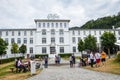 Broc, Switzerland - July 27, 2019: Visitors waiting in front of the building of the famous Cailler chocolate factory. People in