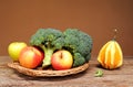 Broccoli, apples and decorative pumpkins