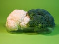 Broccoli and cauliflower. Green background. Healthy lifestyle