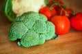 Broccoli, Cauliflower, tomato on the wooden board