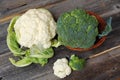 Broccoli and cauliflower on a wooden table Royalty Free Stock Photo