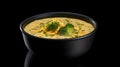 Broccoli cheddar soup in black bowl, dark isolated background. Banner