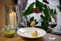 Broccoli cream-soup with grilled prawns and asparagus. On a wooden table with a glass of red wine Royalty Free Stock Photo