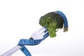 Broccoli on fork and tape measure Royalty Free Stock Photo