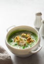 Broccoli and green peas soup-puree in white bowl close up Royalty Free Stock Photo