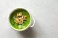 Broccoli and green peas soup-puree in white bowl close up Royalty Free Stock Photo