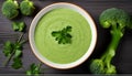 Broccoli green soup with fresh parsley. Healthy and diet vegan dish. Top view on stone table