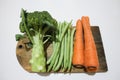 Broccoli, greenbeans and carrot on the wooden board