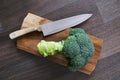 Broccoli, knife, chopping board