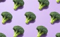 Broccoli lined up regularly on a purple background Royalty Free Stock Photo