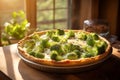 Broccoli pie on wooden table at sunlight ready for consumption