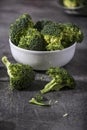 Broccoli pieces on a granite tabletop. Cooking preparation.