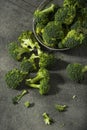 Broccoli pieces on a granite tabletop. Cooking preparation.