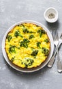 Broccoli potato tortilla on grey background, top view. Delicious breakfast