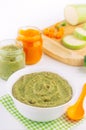 Broccoli puree on the light background near ingredients Royalty Free Stock Photo