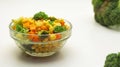Broccoli salad with carrot and corn cernels in a glass bowl Royalty Free Stock Photo