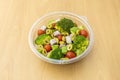 Broccoli salad with ham, chopped green olives, ripe avocados, cherry tomatoes with salt and oil Royalty Free Stock Photo