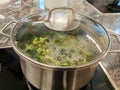 Broccoli soup boiling in a can
