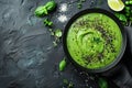 Broccoli, spinach and green peas cream soup on a dark concrete background. Royalty Free Stock Photo