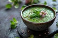 Broccoli, spinach and green peas cream soup on a dark concrete background. Royalty Free Stock Photo