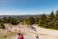 People hiking towards the top of Brocken mountain in Germany