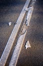 Brocken line of an asphalt road marking close-up