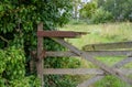 Brocken wooden gate with padlock Royalty Free Stock Photo