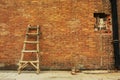 Broke brick wall and ladder