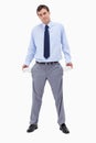 Broke businessman showing his empty pockets Royalty Free Stock Photo