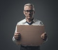 Broke jobless businessman holding a cardboard sign