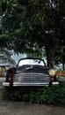 A broken and abandoned ambassador car on the empty street Royalty Free Stock Photo