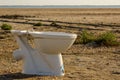 broken abandoned toilet bowl in the desert Royalty Free Stock Photo