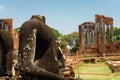 The Broken ancient Buddha image without head.