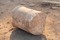 Broken ancient marble column on the ground in Side Ancient City during sunset