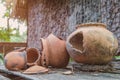 Broken antique clay pot or traditional Jar on abandoned hut Royalty Free Stock Photo