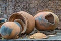 Broken antique clay pot or traditional Jar on abandoned hut Royalty Free Stock Photo