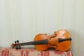 Antique violin for restoration on a table apart sides