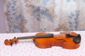 Antique violin for restoration on a table apart sides