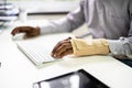 Broken Arm Office Accident. Worker Compensation Royalty Free Stock Photo