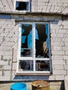 Broken as a result of artillery shelling a window with broken glass Royalty Free Stock Photo