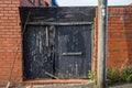 A broken back gate protecting a property Royalty Free Stock Photo