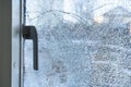 Broken balcony glass door window with shattered glass