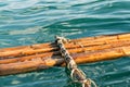 Broken bamboo raft float on the water Royalty Free Stock Photo