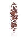 Broken bars of dark chocolate fall down on white background Royalty Free Stock Photo
