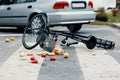 A broken bike on a pedestrian crossing after a collision with a