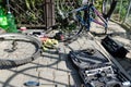 Broken bike, wheel and axle replacement. In the background of tools and parts.